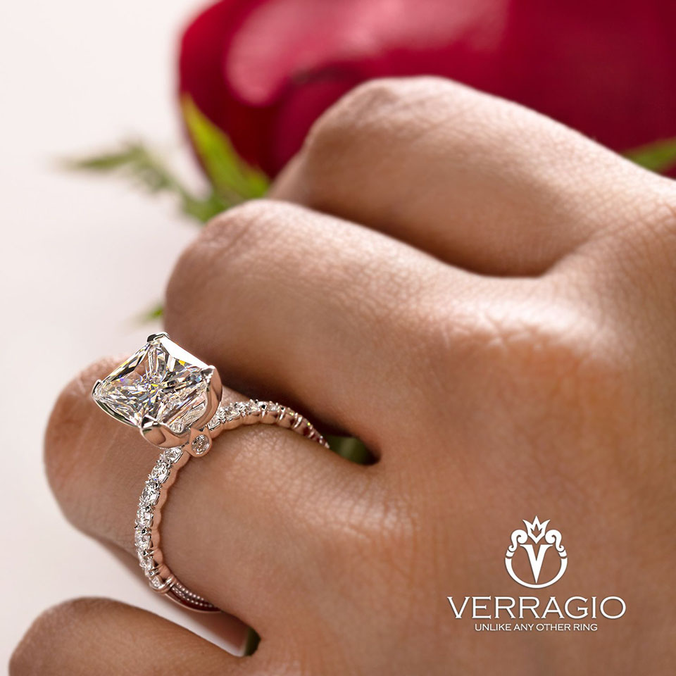hand wearing princess cut diamond ring