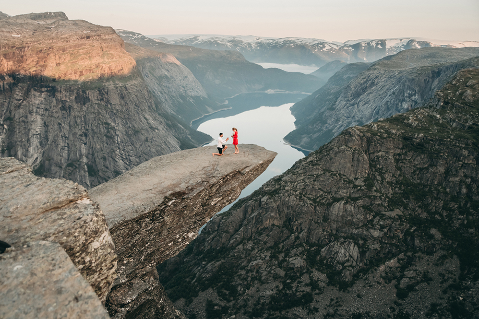 a proposal happening on a cliff
