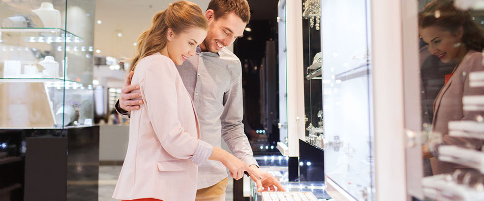a couple shopping for engagement rings