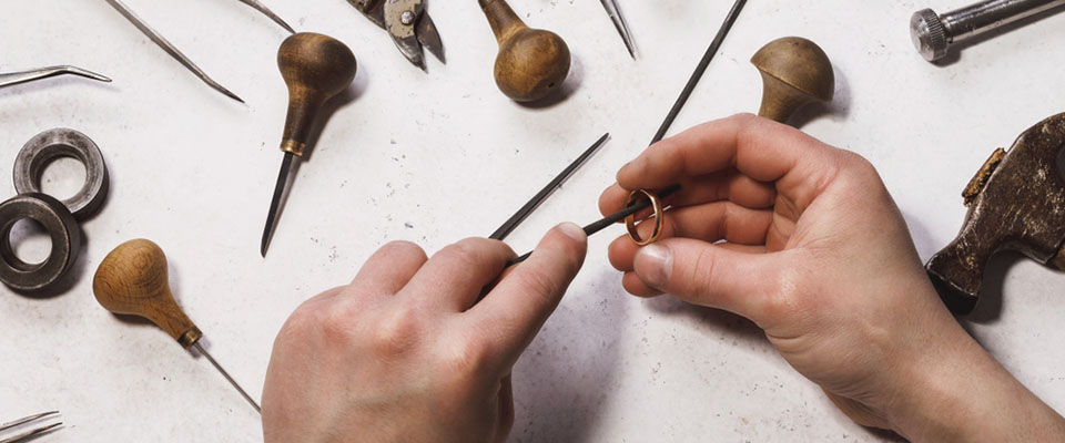 a jeweler repairing a ring