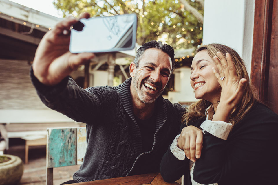 just engaged couple taking selfie