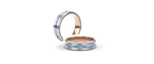 a mens wedding band in silver and rose gold